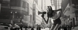 street mktng young woman with megaphone on city street utc copia